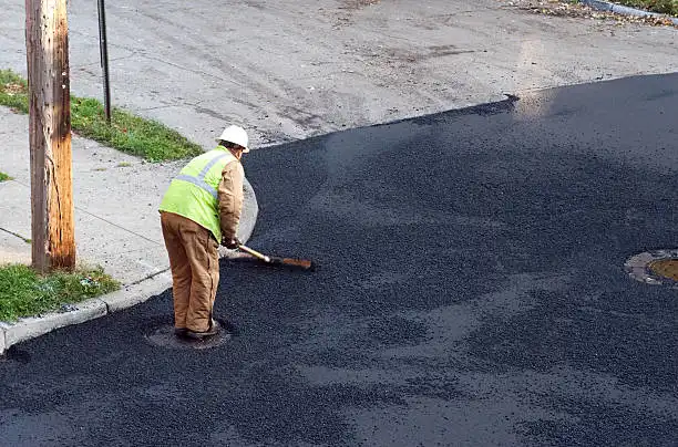 Asphalt driveway layers showing the base, subbase, and paved surface